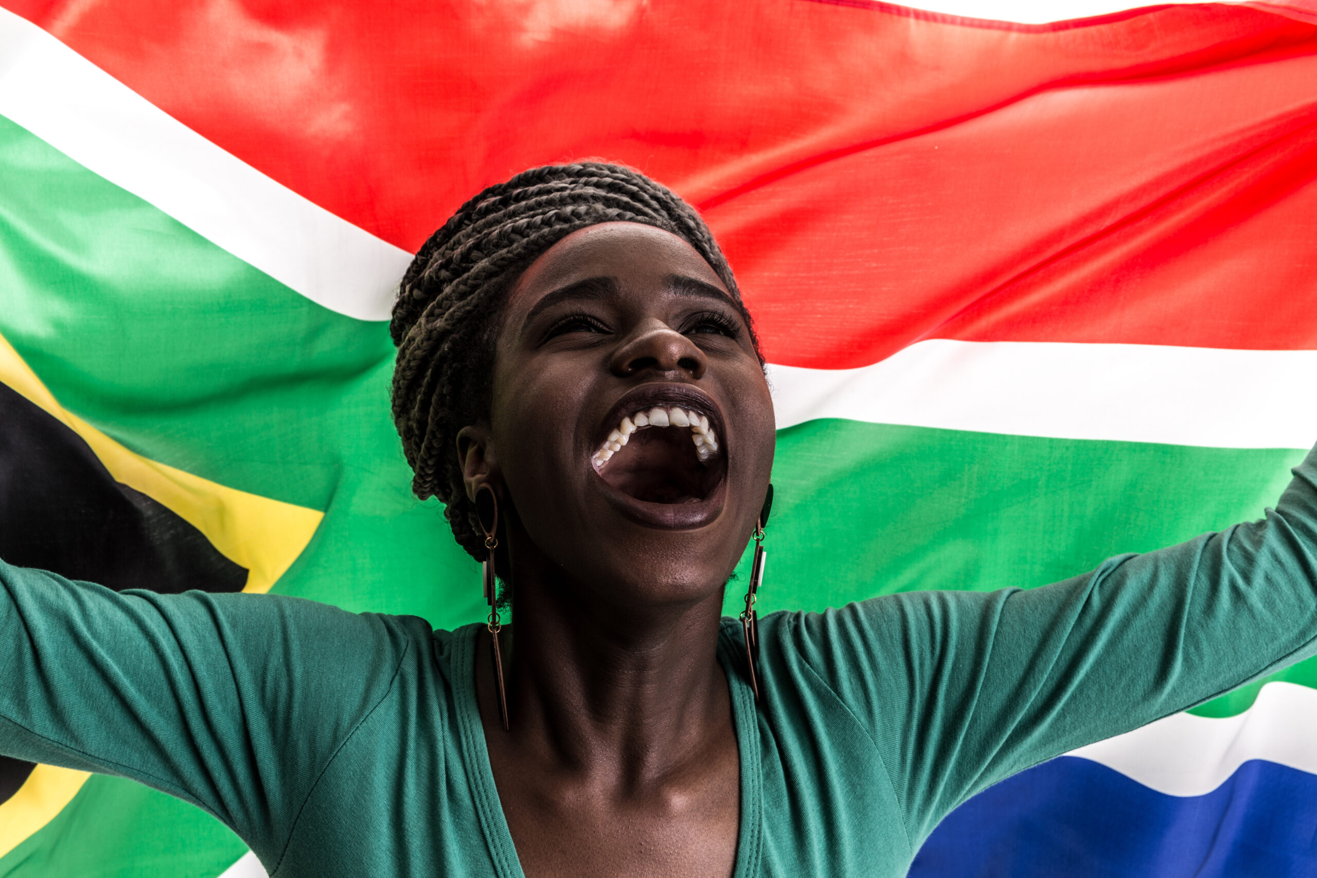 South African fan celebrating with the national flag